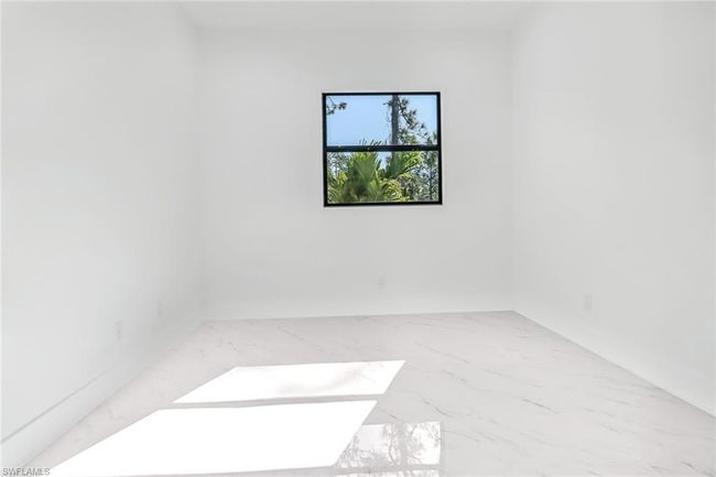 View of tiled spare room | Image 13