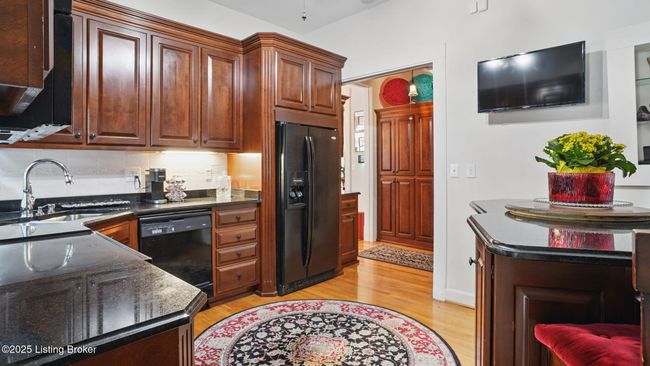 The kitchen has a large moveable island as well. | Image 16