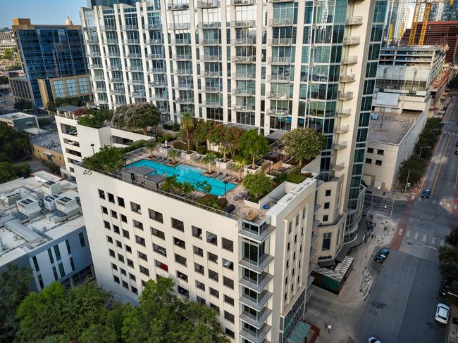View of urban area with apartment complex / building and a pool | Image 15