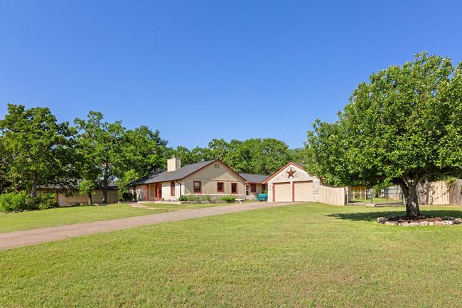 Home is surrounded by beautiful trees creating a tranquil property. | Image 39