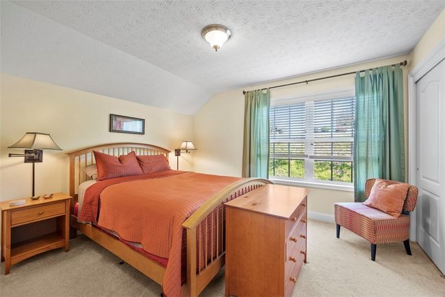 Each bedroom has larger windows to filter in natural light and natural color carpeting. | Image 36