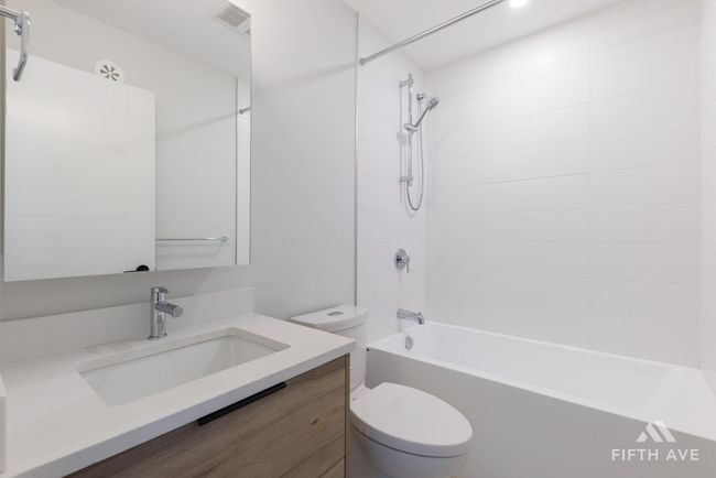 Bathroom with vanity and shower / tub combination | Image 31