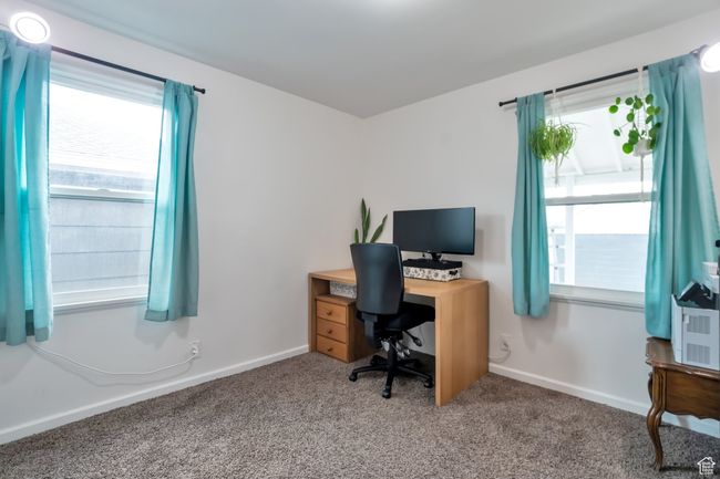 Home office with carpet flooring and baseboards | Image 10