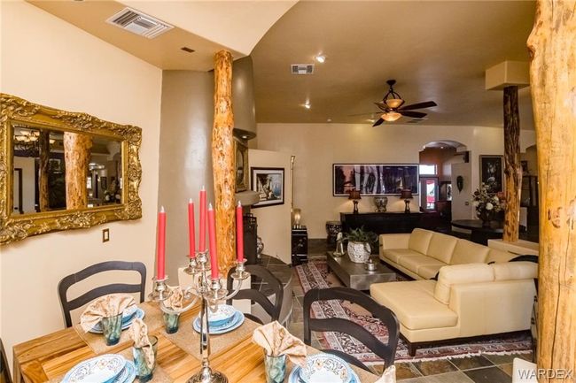 Living room featuring ceiling fan and arched walkways | Image 46