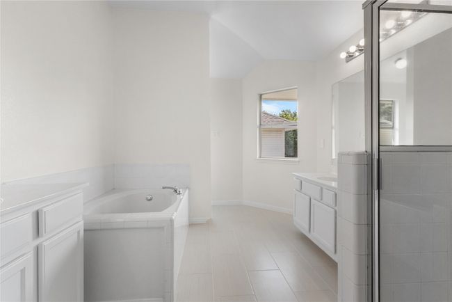 Bathroom with vanity and a garden tub | Image 15