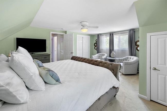 2nd Floor Bedroom featuring ceiling fan, carpet floors, and lofted ceiling | Image 18