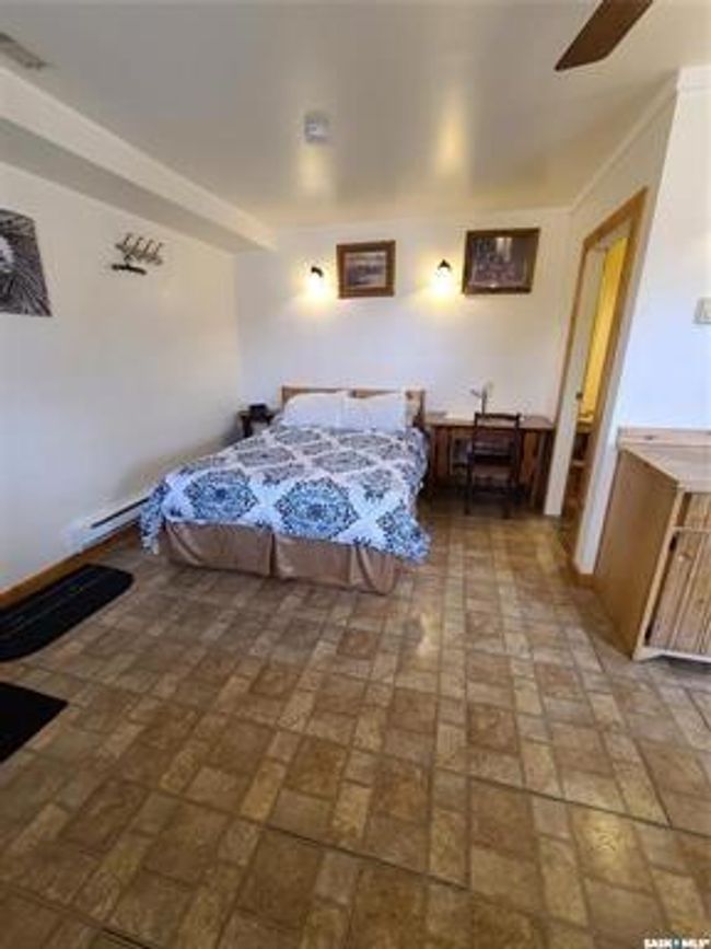 Bedroom featuring ceiling fan | Image 24