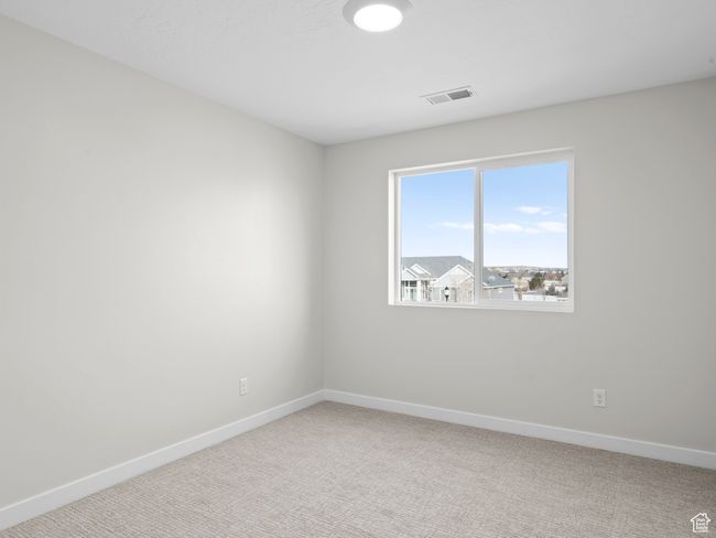 Carpeted spare room with visible vents and baseboards | Image 20