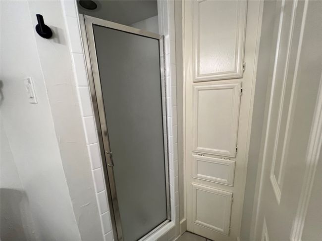 Bathroom with a stall shower | Image 25
