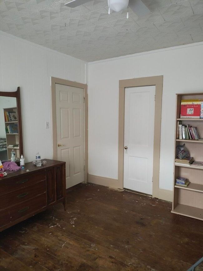 Bedroom featuring hardwood / wood-style flooring and crown molding | Image 15