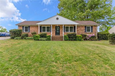 Single story home featuring a front lawn | Image 1