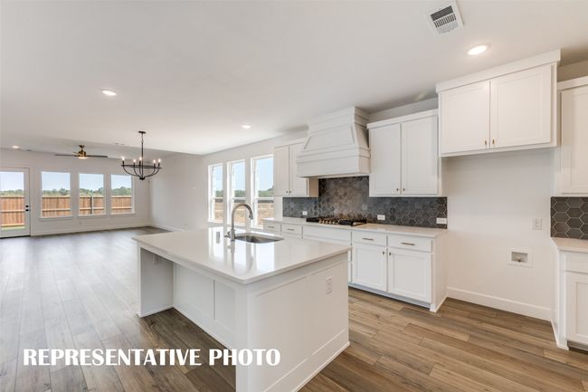 Our Sebastien floor plan offers a fantastic open concept main floor featuring a dream kitchen! REPRESENTATIVE PHOTO | Image 5