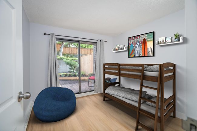 Bedroom featuring wood finished floors and access to exterior | Image 13