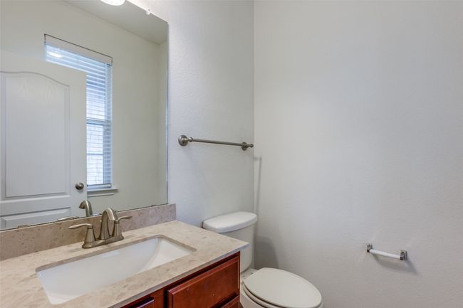 Bathroom with toilet and vanity | Image 21