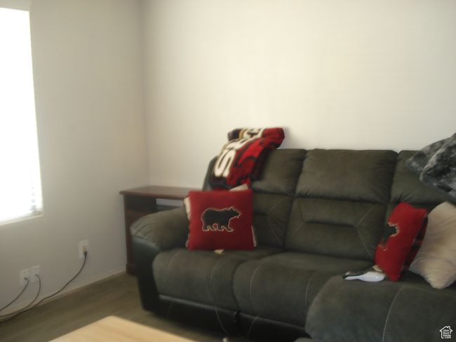 Living room with wood finished floors and baseboards | Image 7