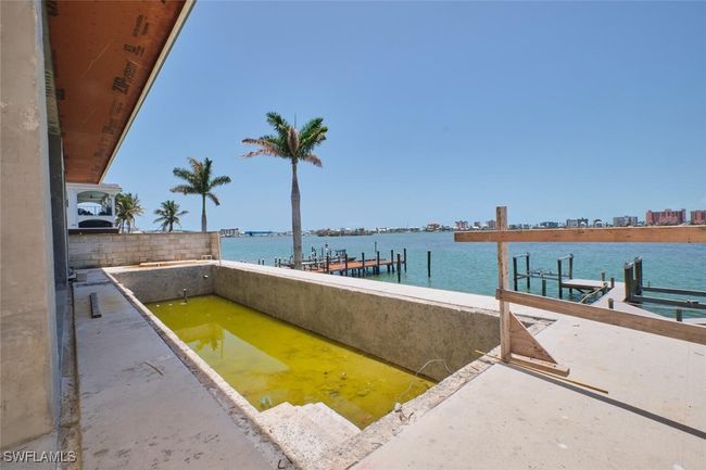 Dock area featuring a water view | Image 15