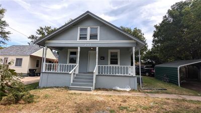 Bungalow-style house with covered porch and a carport | Image 2