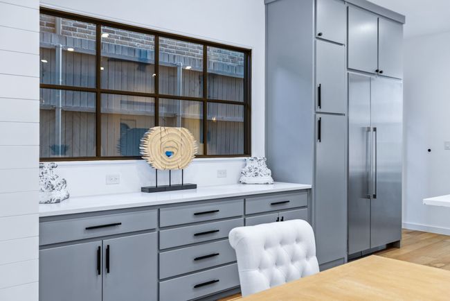 Office space with light wood-style flooring and baseboards | Image 9
