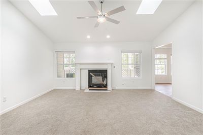 16x14Carpet, Fireplace, Vaulted Ceilings, Skylight | Image 3