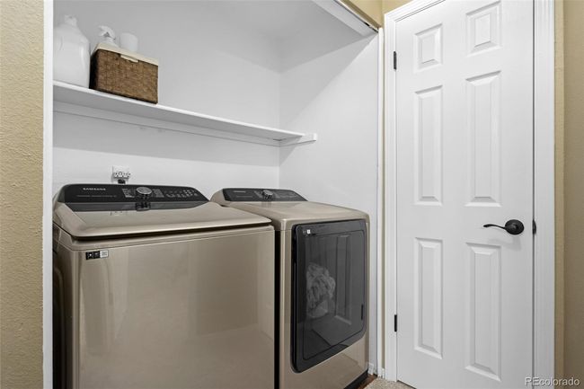 Upstairs laundry nook with linen closet. | Image 17