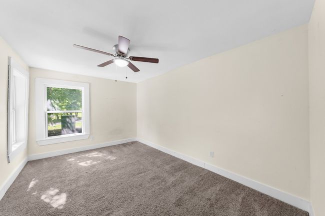 Unfurnished room featuring carpet flooring, ceiling fan, and baseboards | Image 18