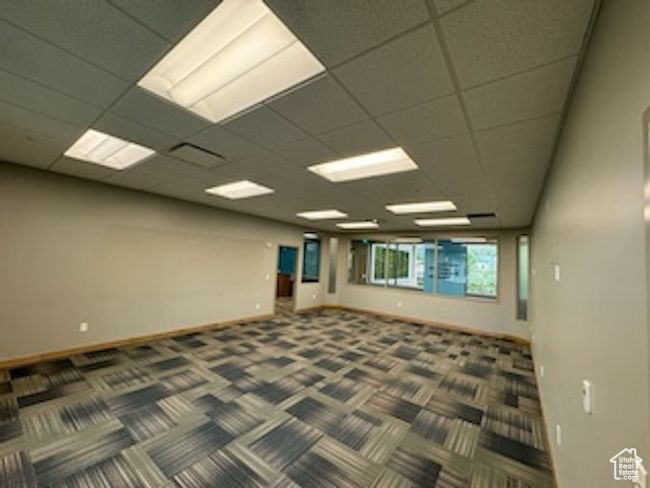 Carpeted spare room with baseboards | Image 21
