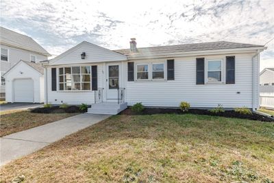 Exterior front with new landscape beds | Image 1