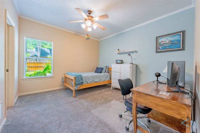 Bedroom featuring carpet flooring, ornamental molding, and ceiling fan | Image 17
