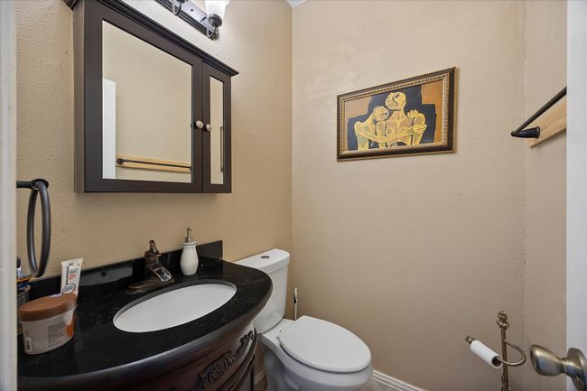 Half bathroom featuring toilet and vanity | Image 18