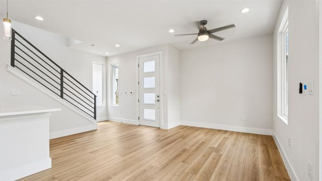 Entrance foyer with recessed lighting, healthy amount of natural light, stairs, light wood-type flooring, and ceiling fan | Image 7