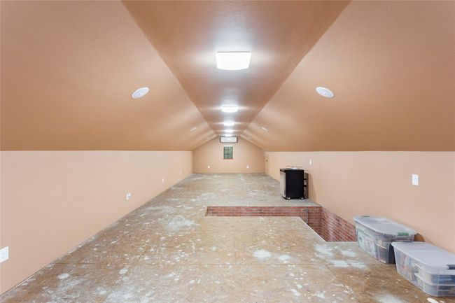 Attic storage with surround sound, electricity and 2 small doors that open up to full storage that runs down each side. | Image 31