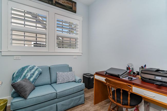 Home office with wood finished floors | Image 17