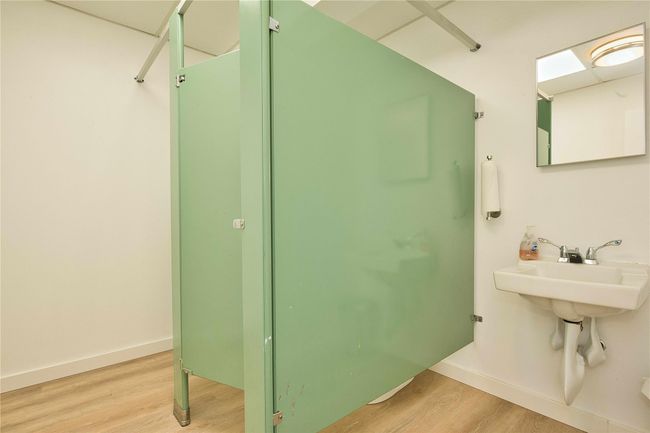 Bathroom featuring wood finished floors and baseboards | Image 9