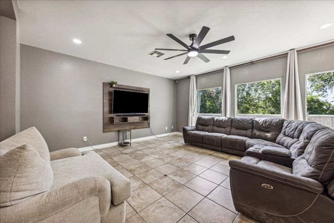 Living area featuring recessed lighting, visible vents, a wealth of natural light, and ceiling fan | Image 8