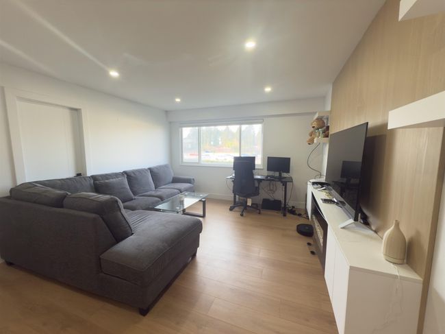 Living room with recessed lighting and light wood-type flooring | Image 6
