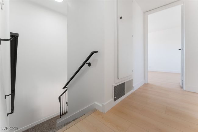 Stairs featuring wood finished floors and baseboards | Image 24