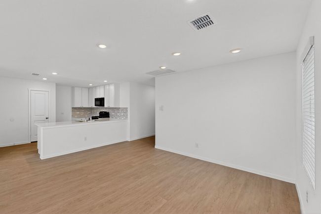 Unfurnished living room featuring recessed lighting, light wood-type flooring, and baseboards | Image 7
