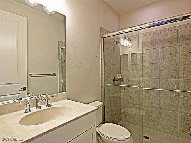 Full bath with a stall shower, vanity, and toilet | Image 20