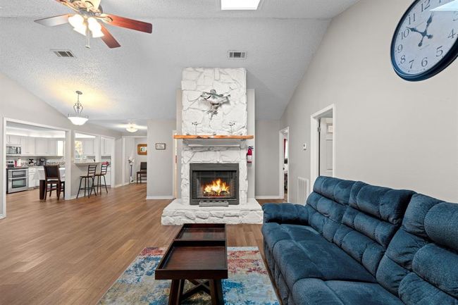 Open concept with fireplace. | Image 4