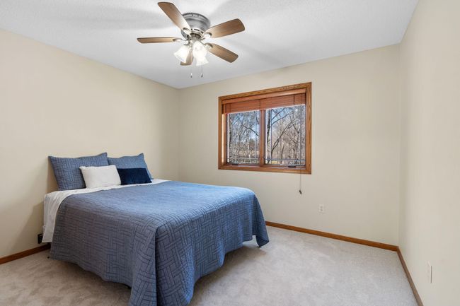 The second bedroom also has tons of light and features a view of the property. | Image 16