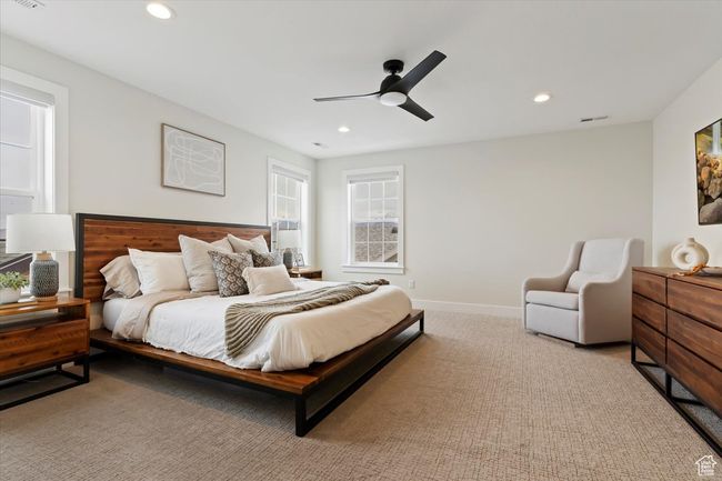 Bedroom featuring carpet, ceiling fan, visible vents, and recessed lighting | Image 17
