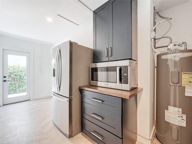 Hallway from kitchen to 1/2 bath & north side of house | Image 20