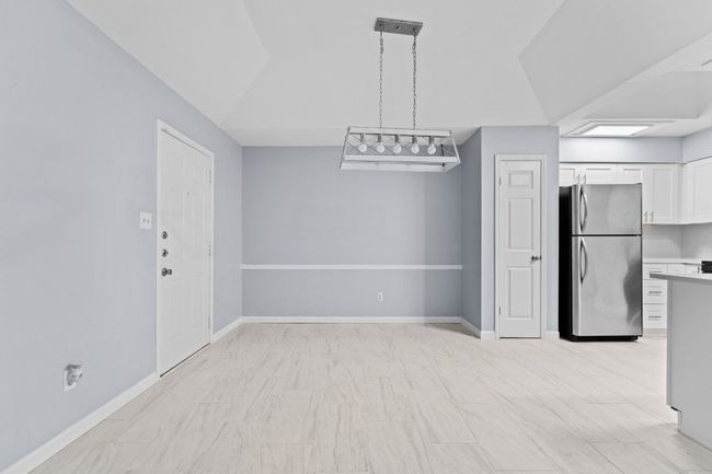 Unfurnished dining area with baseboards | Image 18