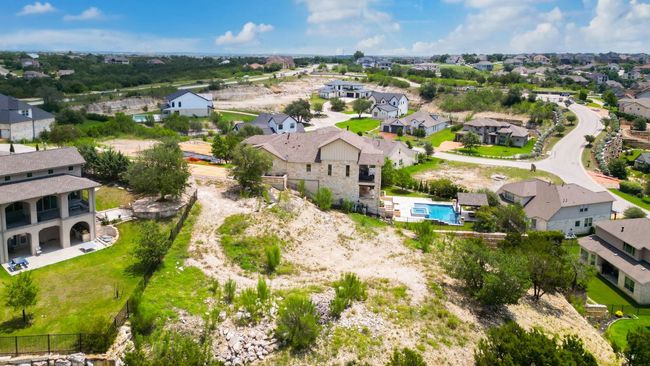 Aerial perspective of suburban area with a pool area | Image 9