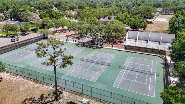 Tennis and racquet ball courts in community park. | Image 7