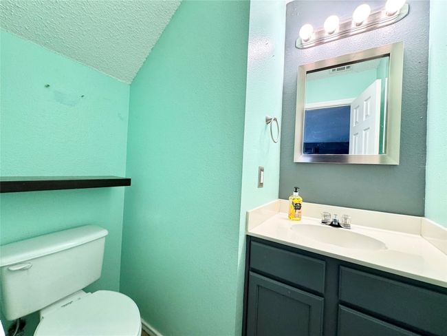 Bathroom with vanity and a textured ceiling | Image 8