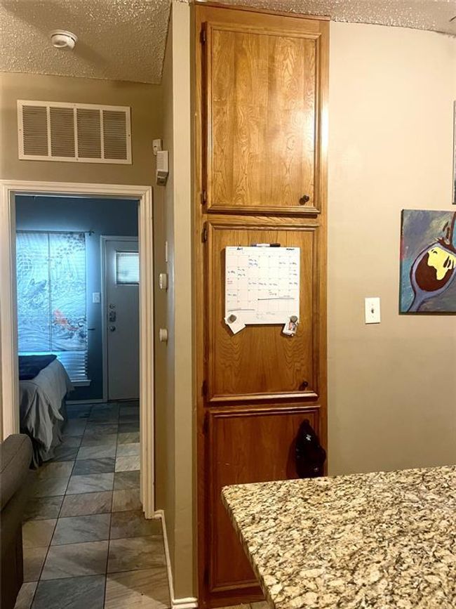 Doorway featuring a textured ceiling | Image 13