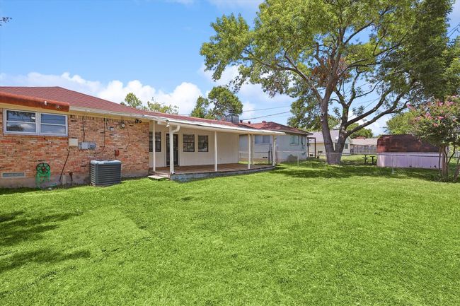Back of house with fence, a yard, and central air condition unit | Image 35
