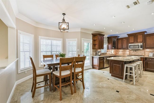 Flooded with natural light from abundant windows. | Image 8