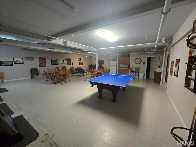 Rec room with ping pong table and TV area | Image 27